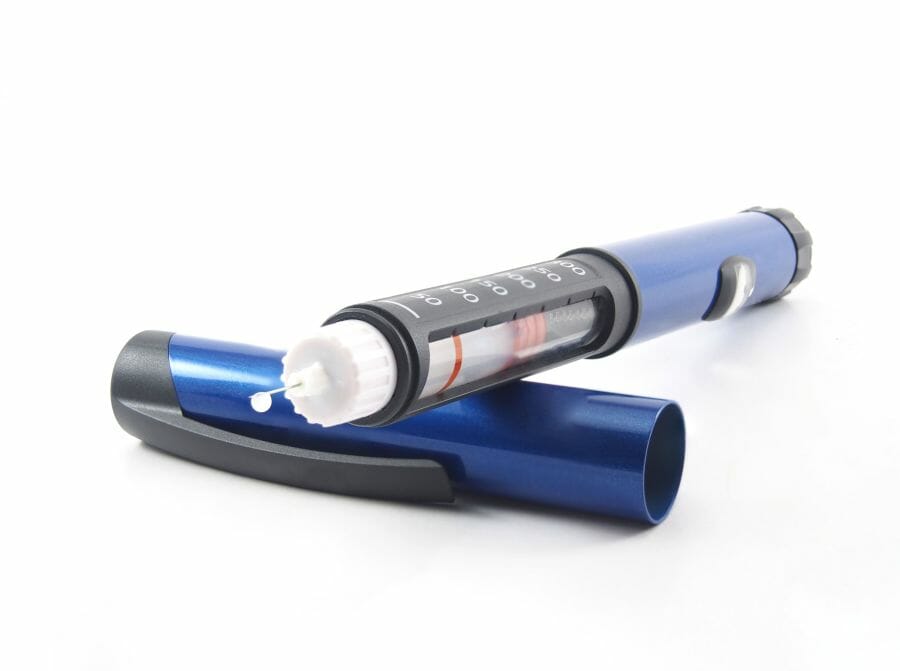 Insulin pen with insulin drop at needle tip: symbolizes translation of medical devices