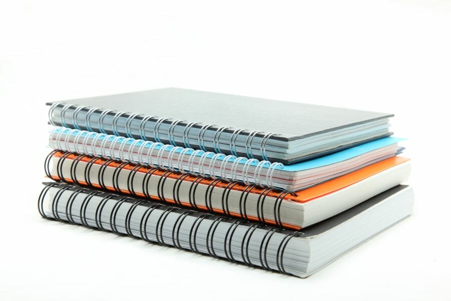 Stack of ring binders: symbolic image of terminology management in technical translation